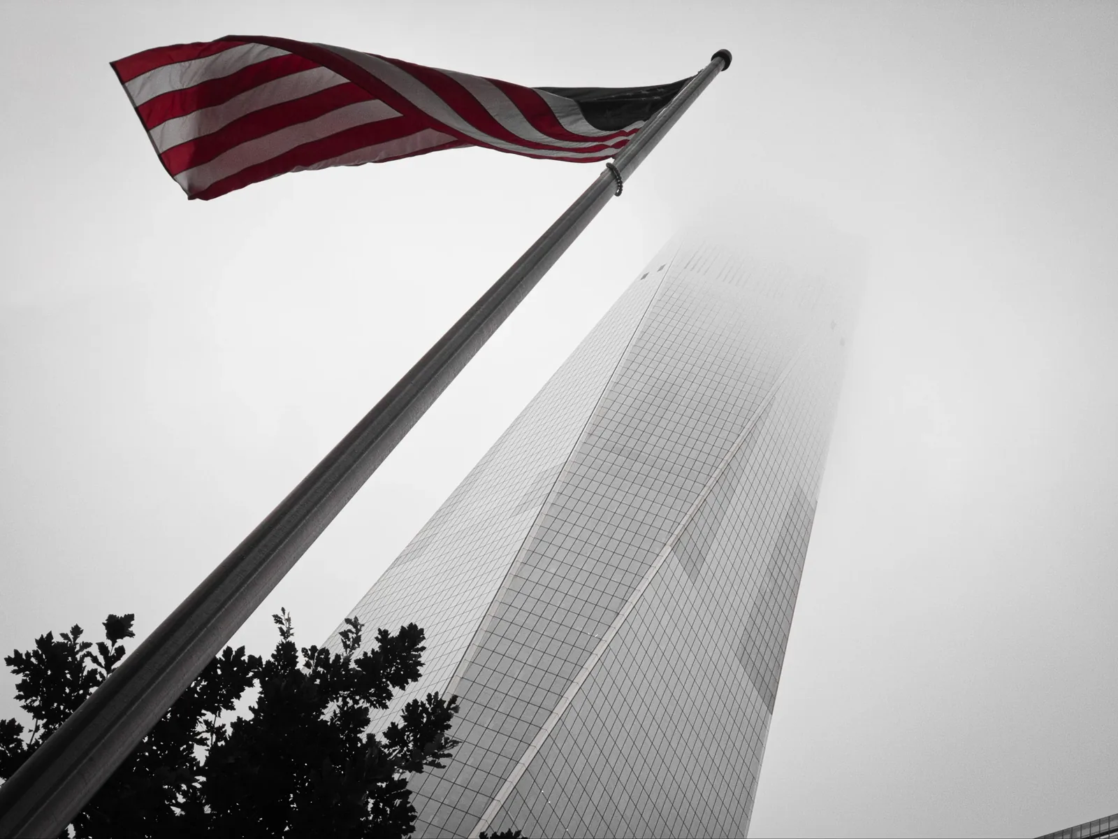 One World Trade Center behind an American flag