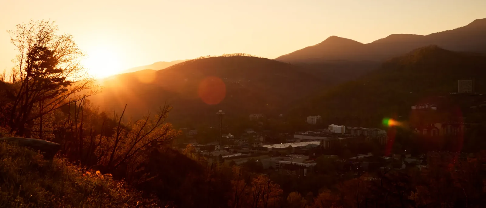 Sun over a hazy mountain valley