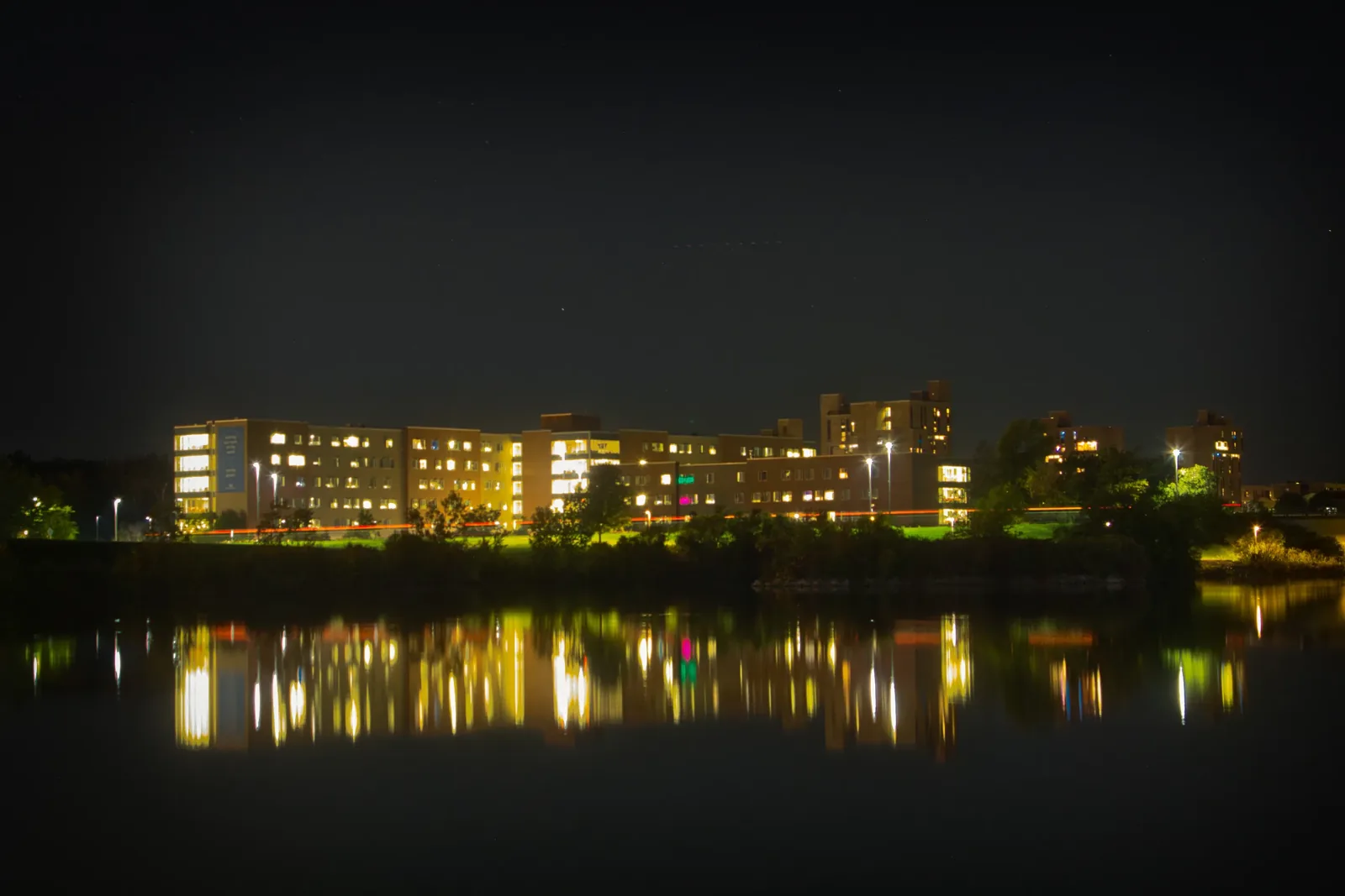 City lights reflected on dark water
