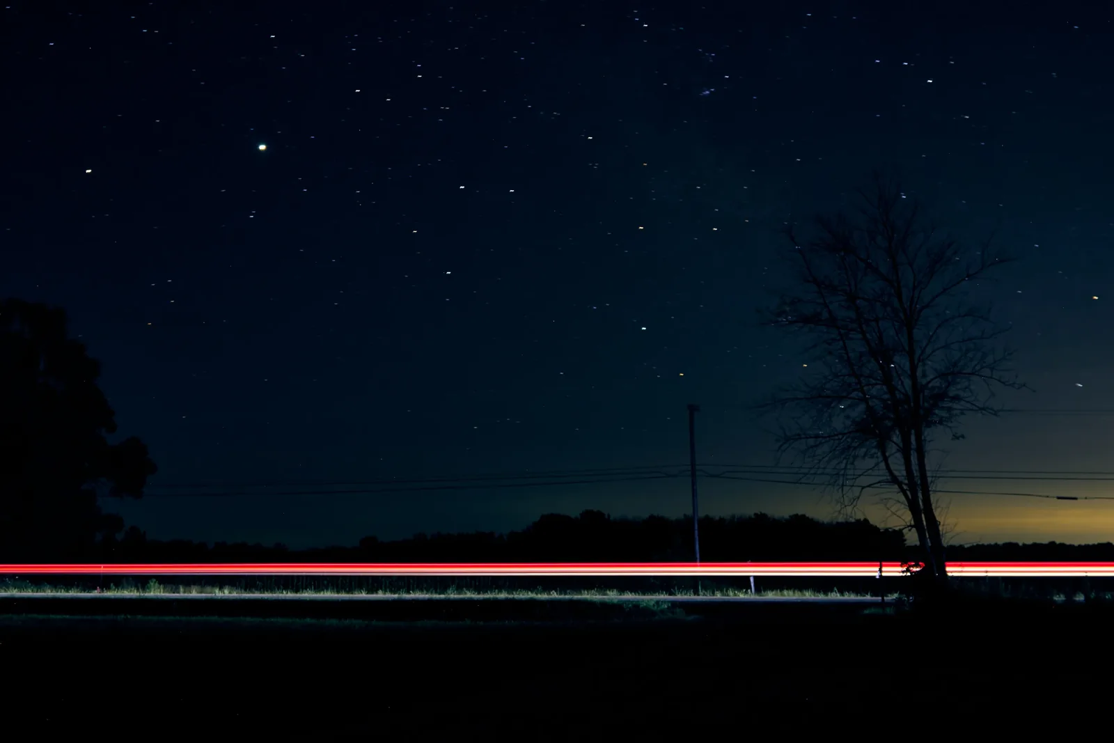Comet NEOWISE low over the horizon at dusk