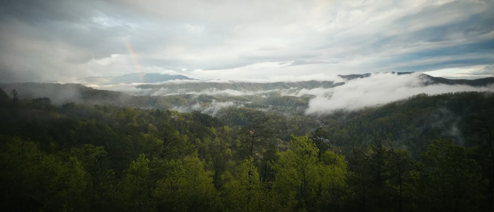 Layered mountains in morning haze