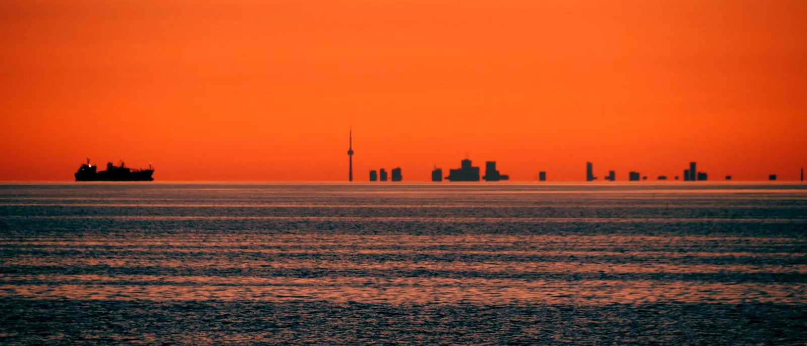 An orange sunset over open water