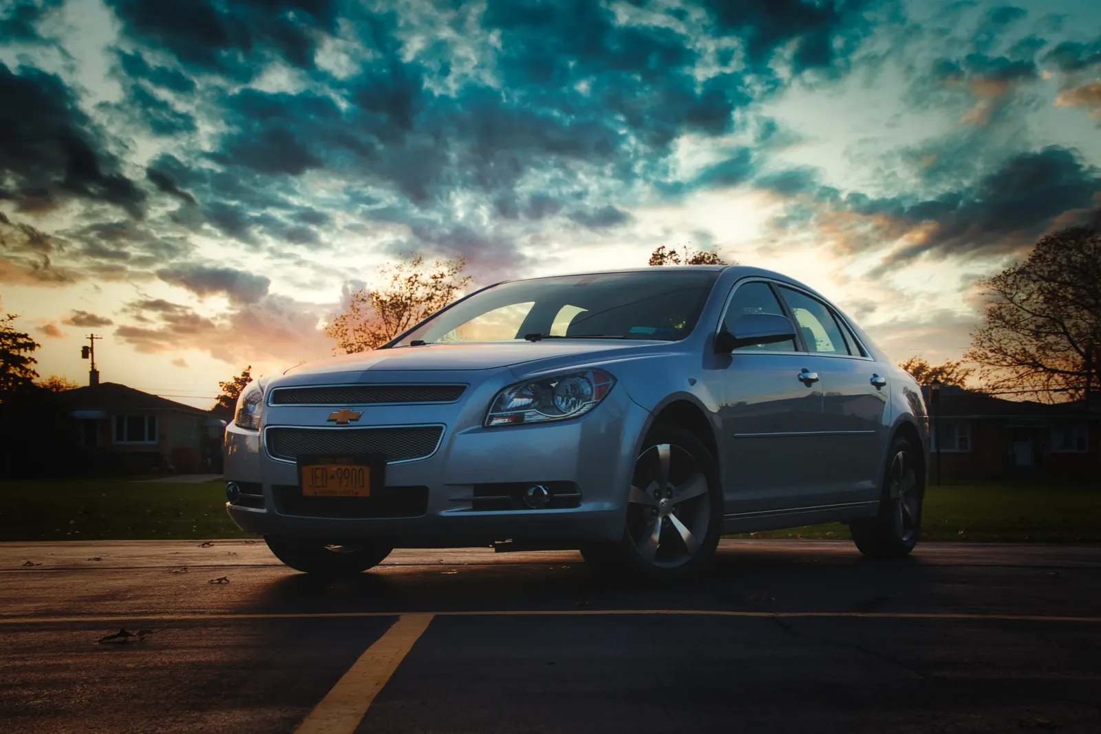 A car beneath a cloudy sky