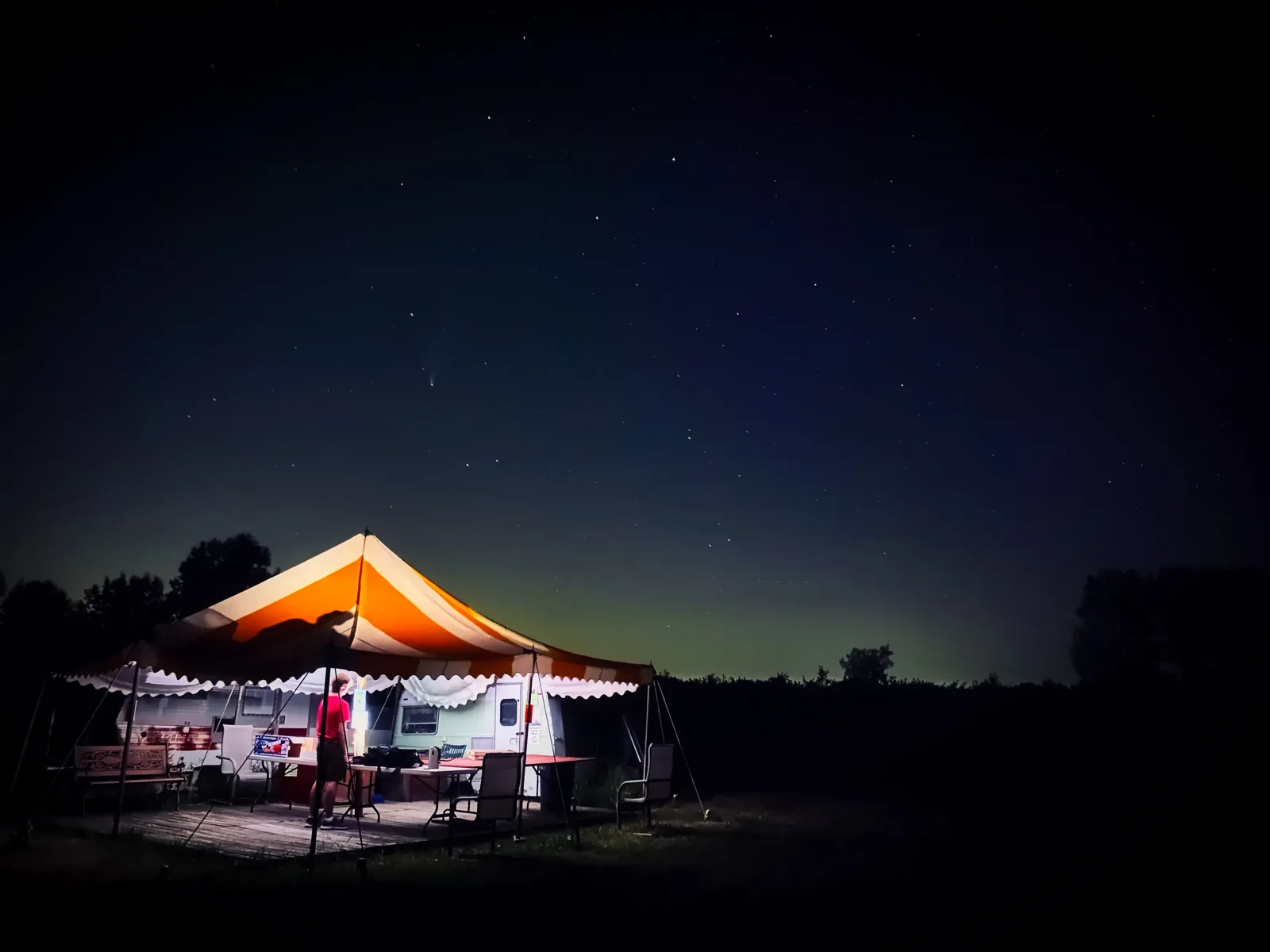 A lit event tent at dusk