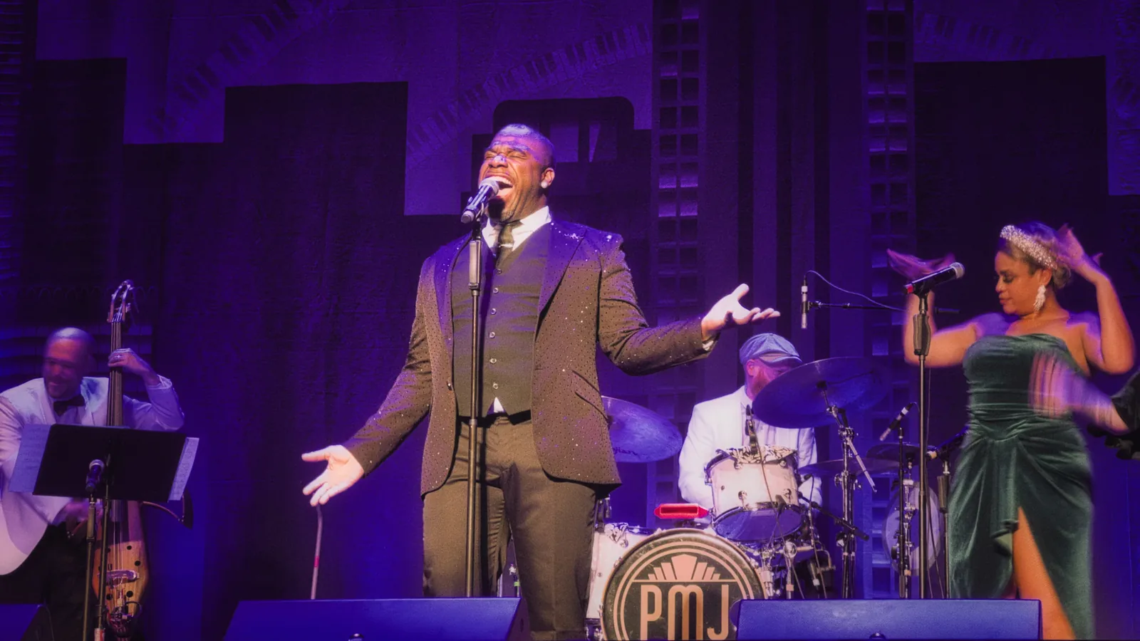 A singer and band performing live