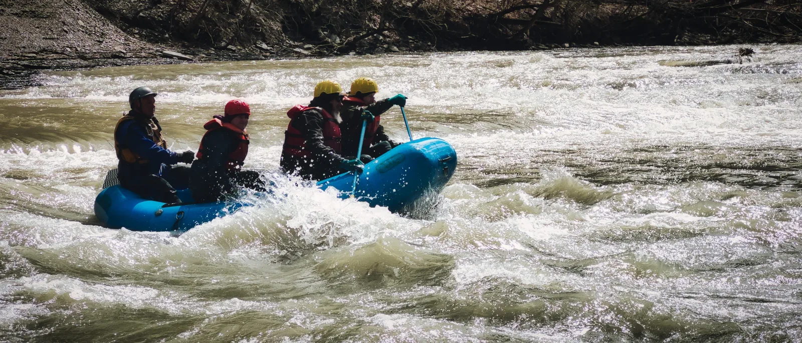 Paddlers running whitewater rapids