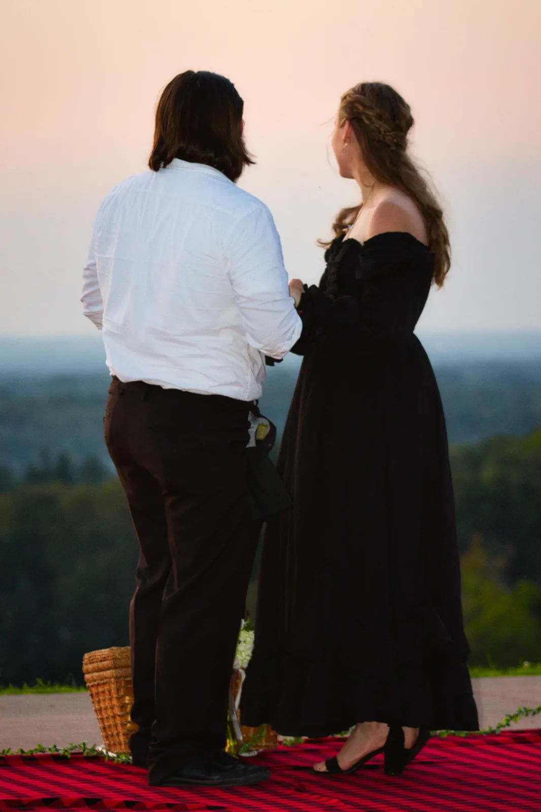 A newly engaged couple at dusk